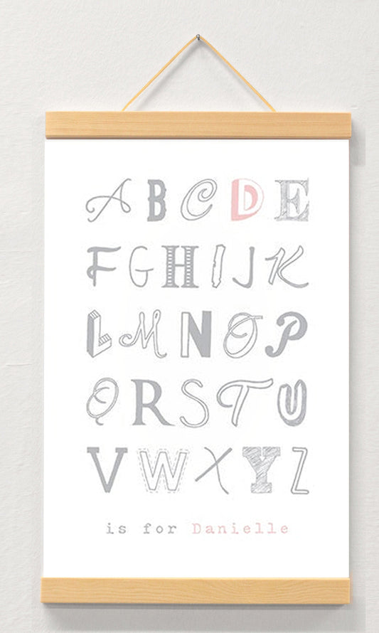 Alphabet print - girl's name displayed in a wooden magnetic hanger