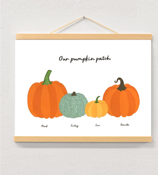 Personalised Family Halloween Pumpkin Print displayed in a wooden magnetic hanger