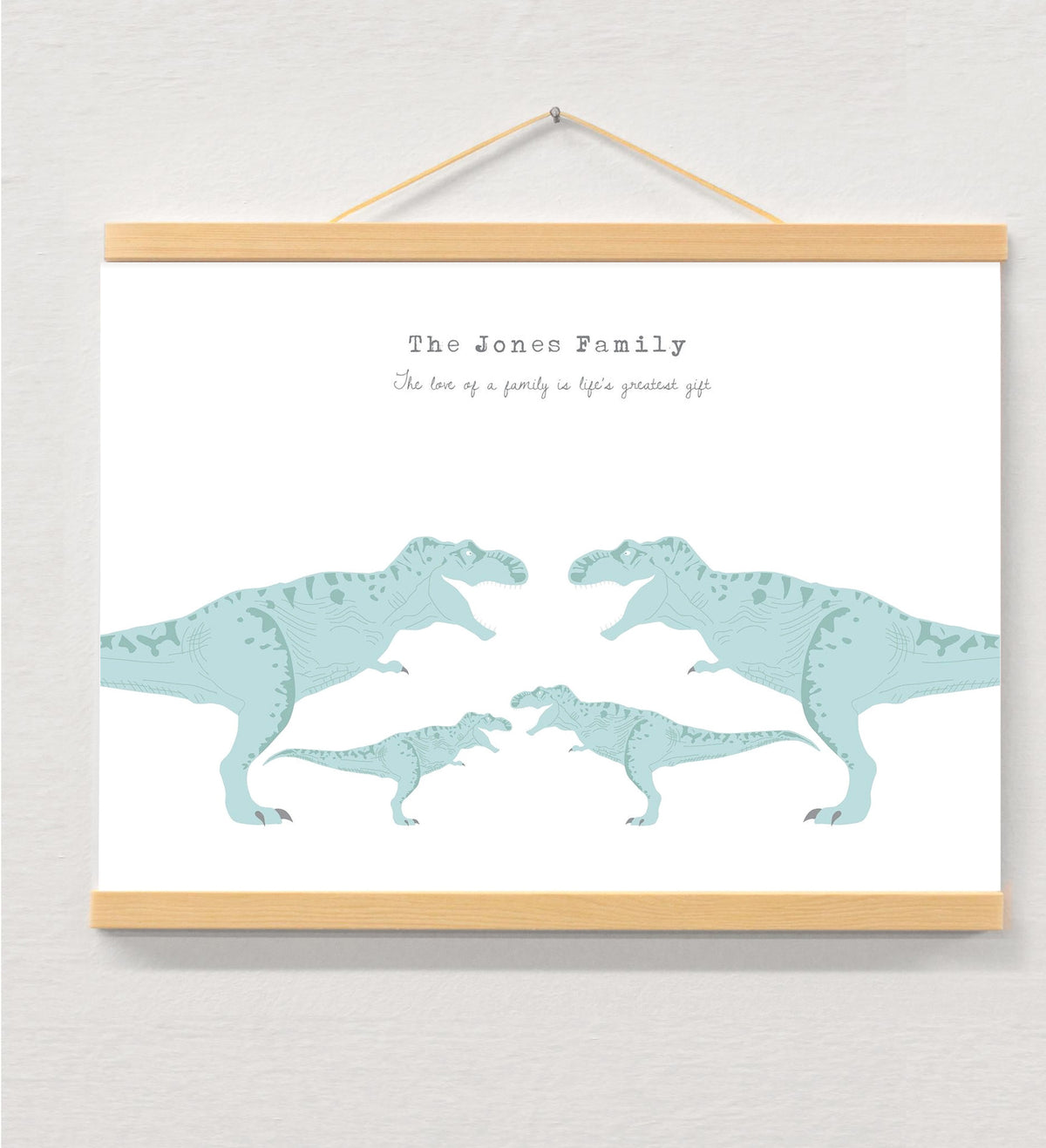 Dinosaur Family Personalised Print displayed in a wooden magnetic hanger