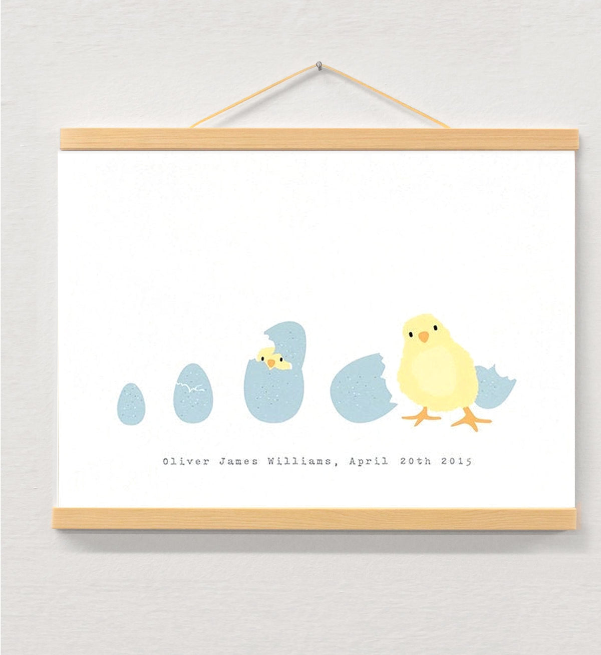 New baby print displayed in a wooden magnetic hanger