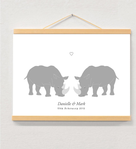 Rhino couple personalised print displayed in a wooden magnetic hanger