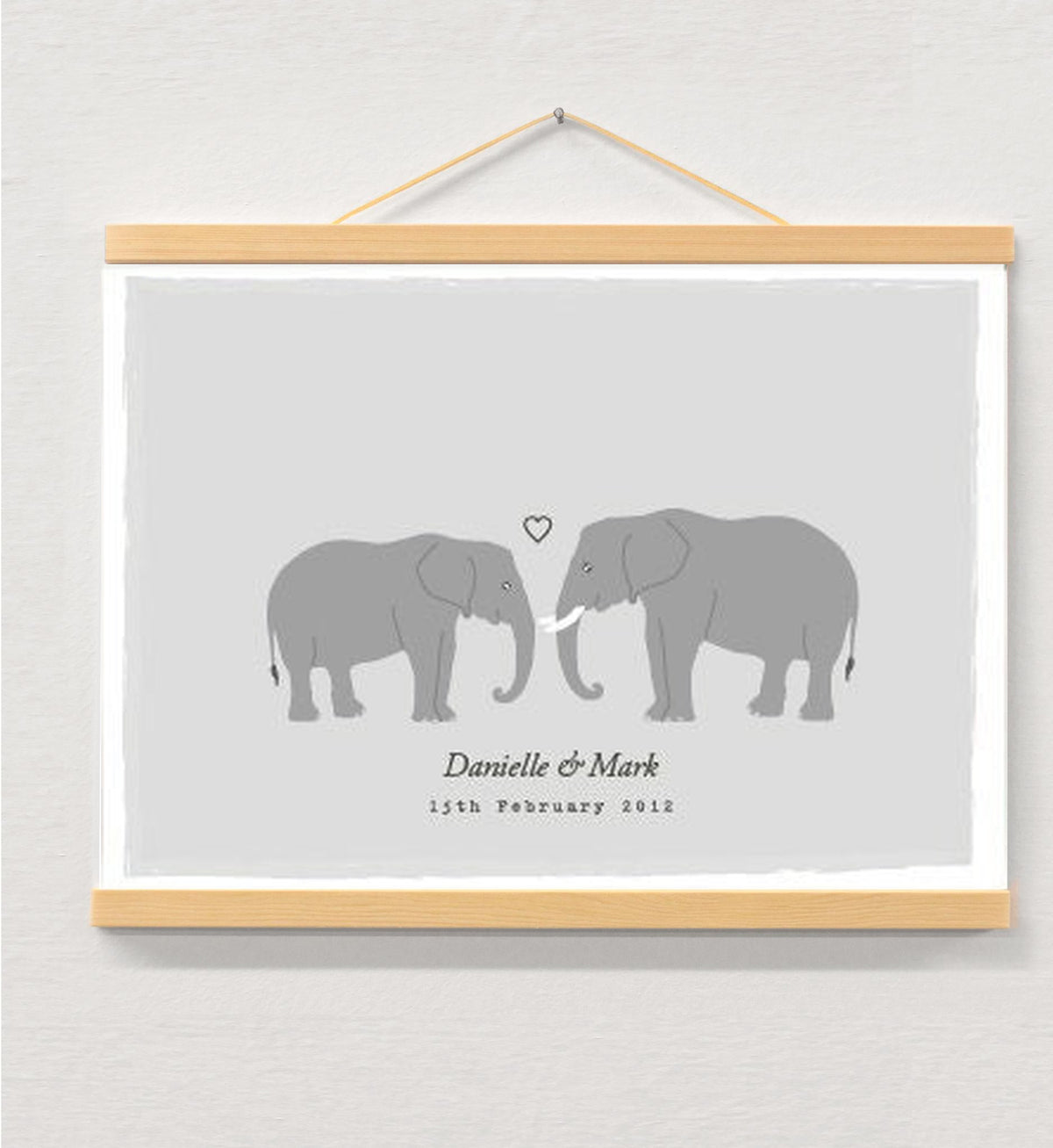 Elephant couple personalised print displayed in a wooden magnetic hanger
