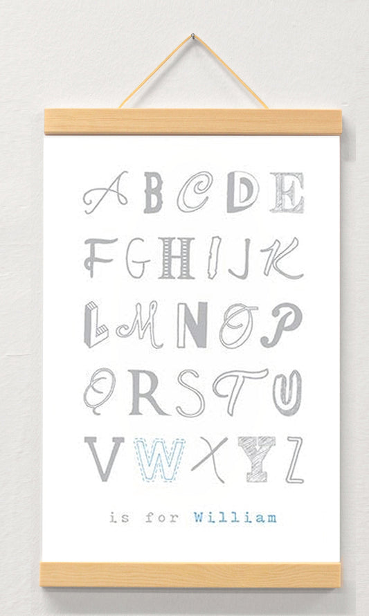 Boy name nursery art displayed in a wooden magnetic hanger