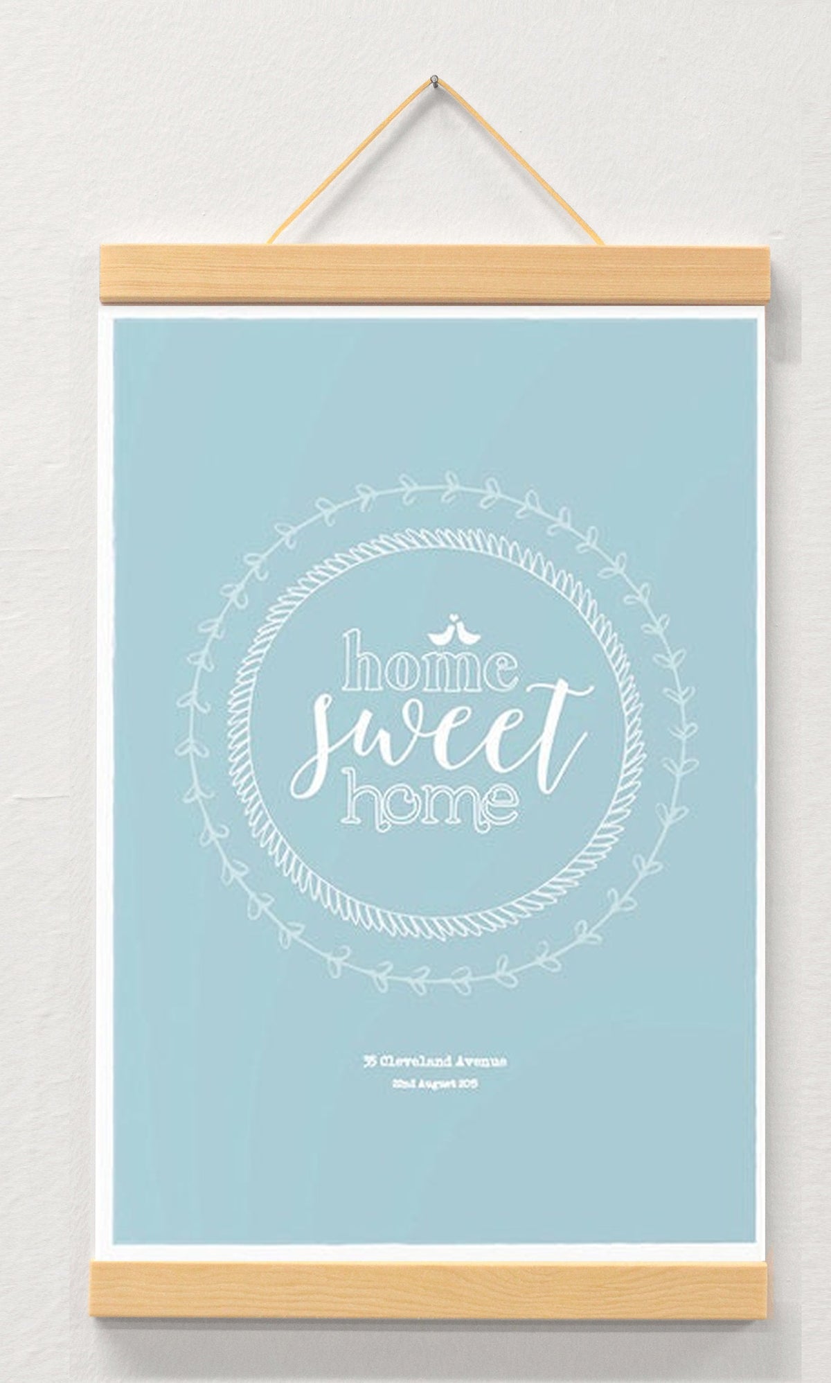 Housewarming personalised print displayed in a wooden magnetic hanger