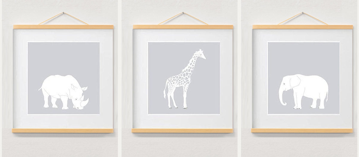 Nursery wall art jungle safari animal prints displayed in a wooden magnetic hanger