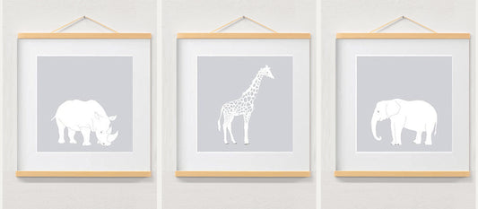 Nursery wall art jungle safari animal prints displayed in a wooden magnetic hanger