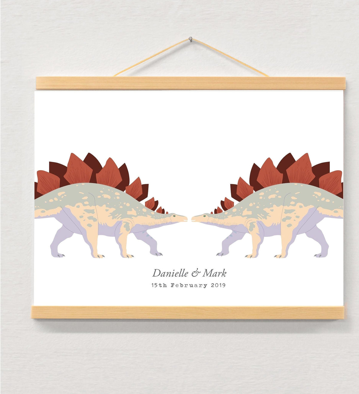 Dinosaur couple personalised print displayed in a wooden magnetic hanger