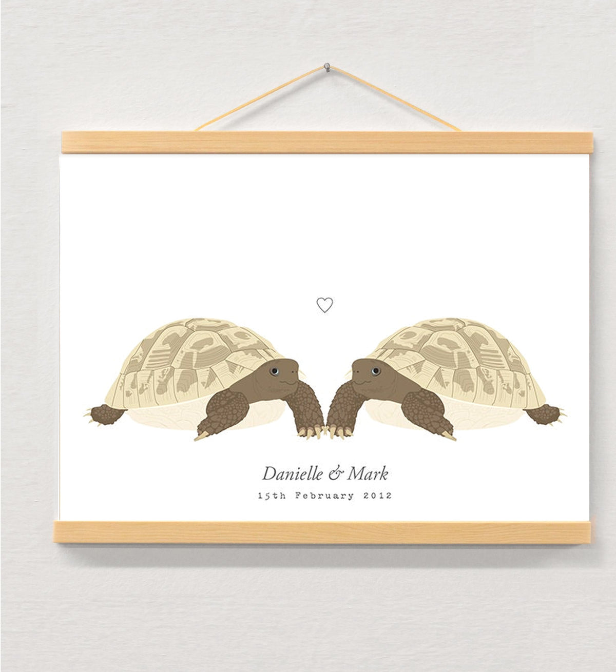Tortoise couple personalised print displayed in a wooden magnetic hanger